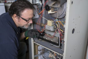 Technician-working-on-furnace